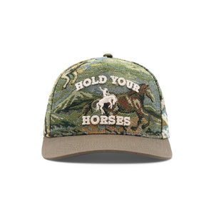 Camouflage cap with 'Hold Your Horses' text and horse graphic on a white background