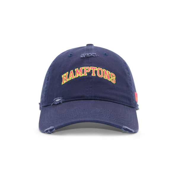 Navy blue cap with 'HAMPTONS' text on a white background