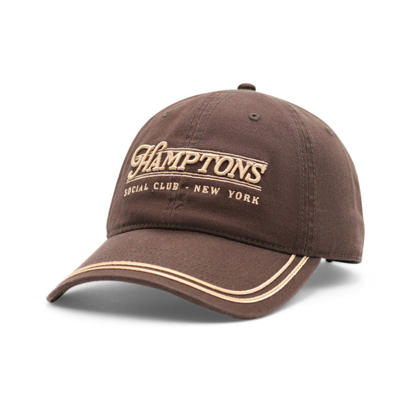 Brown cap with 'Hamptons Special Club New York' text on a white background